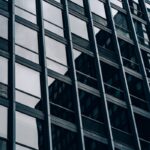 Close-up view of a modern skyscraper's glass and steel facade in downtown Chicago.