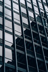 Close-up view of a modern skyscraper's glass and steel facade in downtown Chicago.