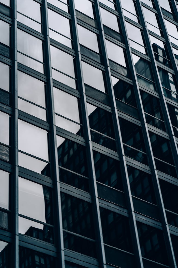 Close-up view of a modern skyscraper's glass and steel facade in downtown Chicago.